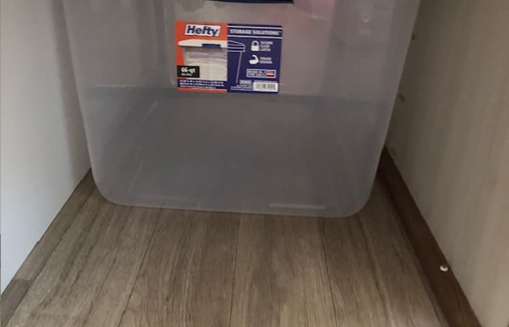 storage bins under the queen bed