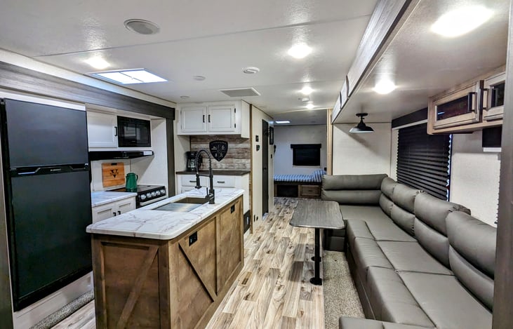 Kitchen with island and living/dining area