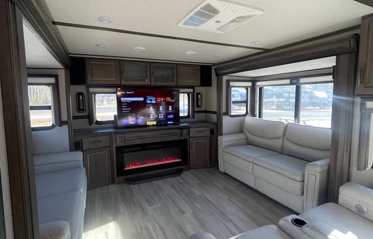 Living room with fireplace, TV, two pull out beds, 2 heated massaging recliners