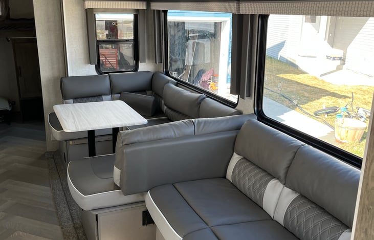 Play games, eat meals, and create memories around the table next to the huge panoramic windows, or fold it down to create another queen size sleep space.