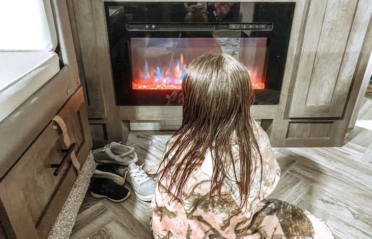 Warm up after a busy day on coast in front of our color changing fireplace.