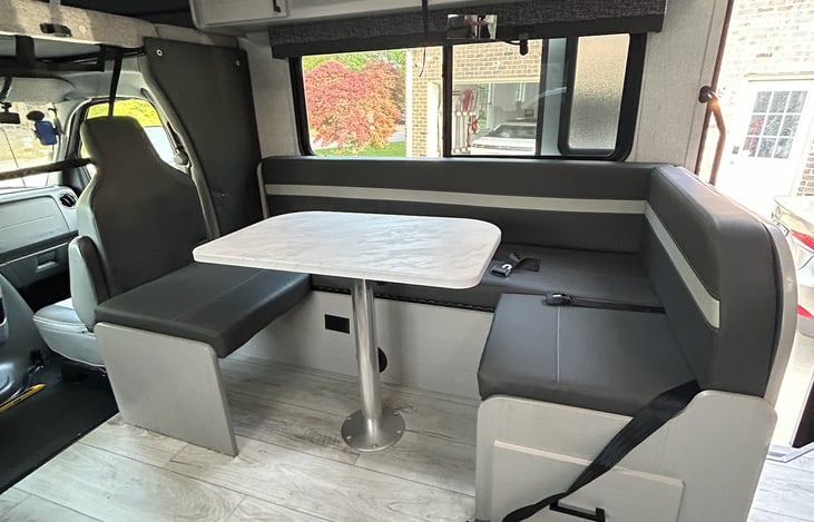 J seating with dining table