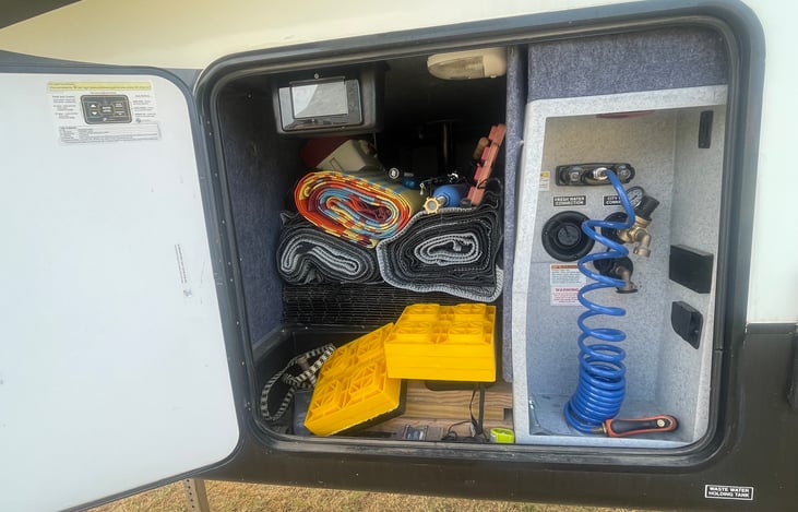 Outdoor storage, outdoor shower hose, and control center panel