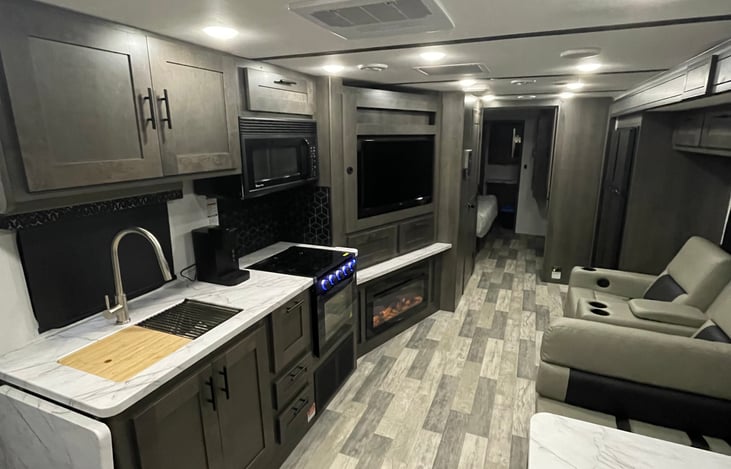 3-Burner Cooktop w/ 22" Oven, Flush Mount Glass Stove Cover, Theatre Seating w/ Cup Holders, Wrap Around Dinette Booth w/ Cup Holders