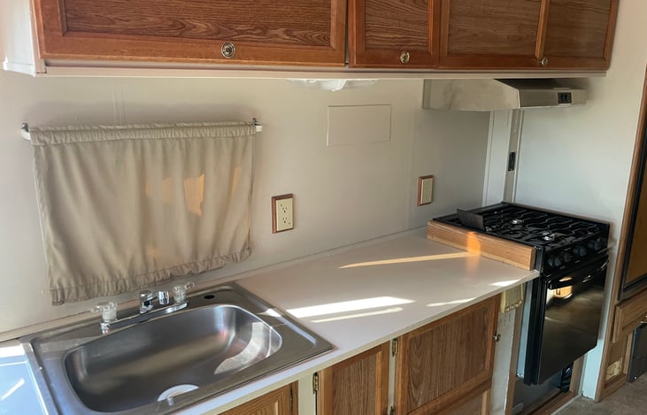 Kitchen sink, Keurig coffee maker and stove with oven!