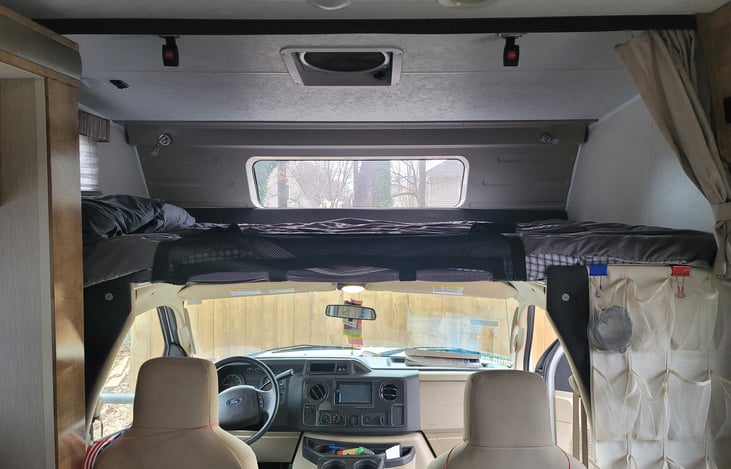 Double bunk, windows in front and one side.  Screen "railing" buckles to ceiling.