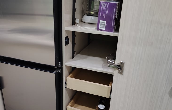 Pantry with slide out drawers.