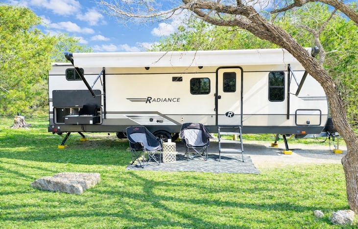 Outdoor entertainment area with stabilizers for a steady setup and an anti-sway hitch system for safer, smoother towing.