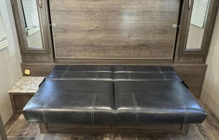 Couch in Down position before releasing latches for mattress to drop down.