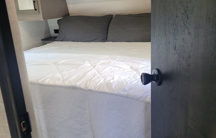 king bedroom has lots of privacy on front end of the camper with the bunk room in the back end