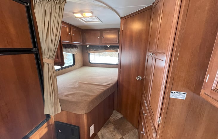 Permanent bed here, 54" x 80".  For comparison, closest in size to full/double, which is 54" x 75".