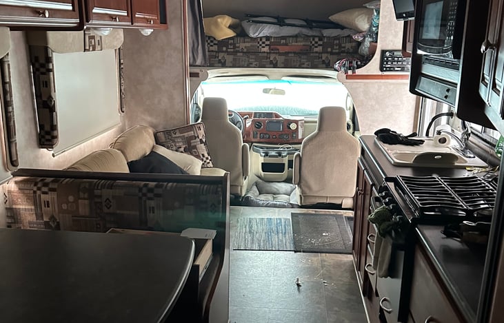 Dining table and the small couch can lay out to accommodate 2-3 kids