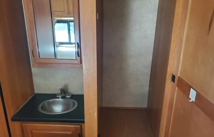 Bathroom sink and storage compartment