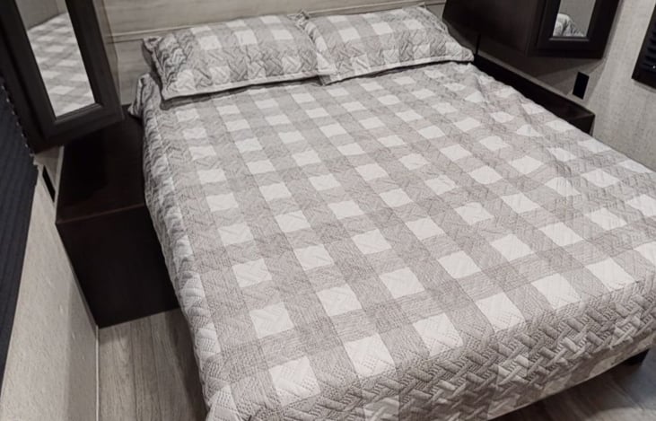 Master Bed room with storage and nightstands on each side.