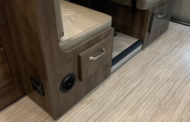 Storage below table which also drops to another sleeping area.