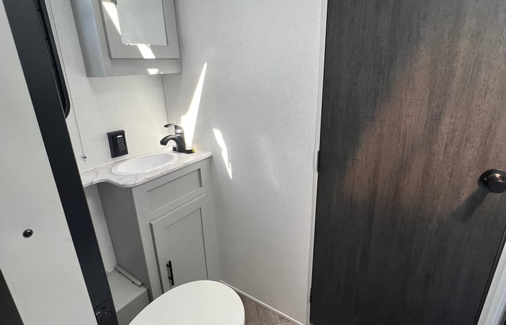 Bathroom area between kitchen and bedroom.