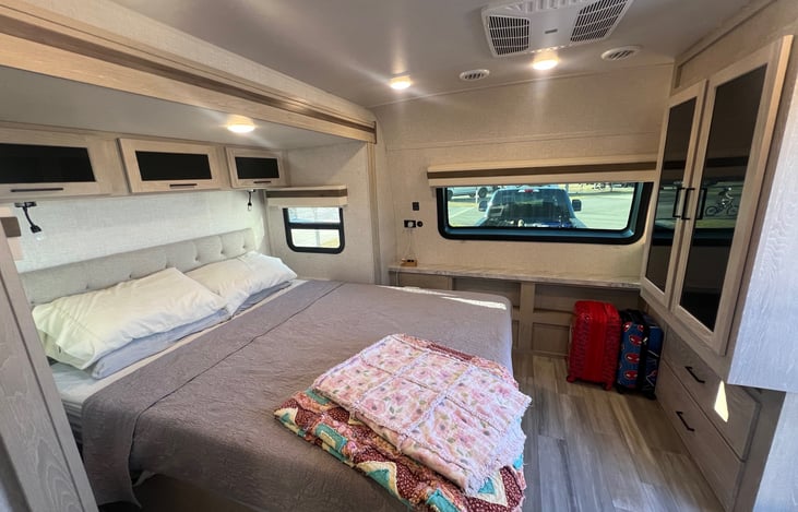 Master bedroom, including queen size bed and a wardrobe. There is also storage above and under the bed.