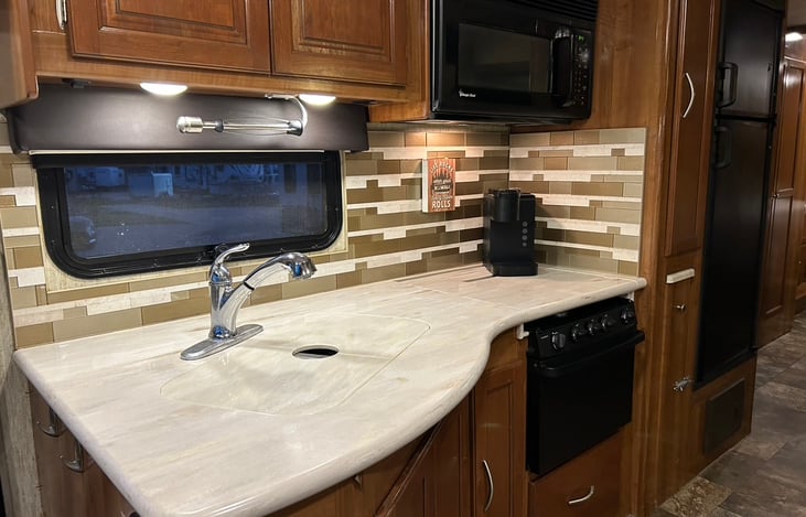One of our favorite parts of RVing is being able to make home cooked meals wherever we are. If you don't want to cook, you'll find a microwave for your convenience.