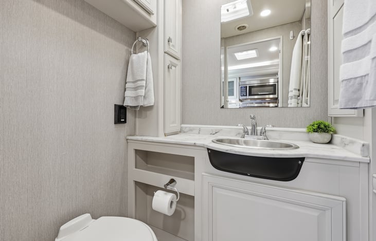1/2 bath has ample storage
