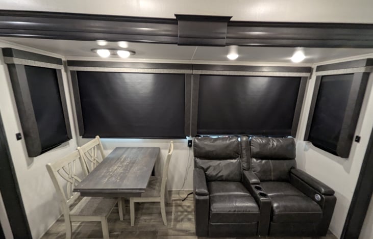 The ultimate hub! Features a chef’s kitchen, theatre recliners facing a 50" TV and fireplace, plus a cozy overhead loft. Luxury meets comfort in this massive, open-concept living space.