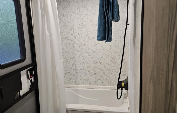 Bath and Shower.  Secondary entrance to access the bathroom from outside.