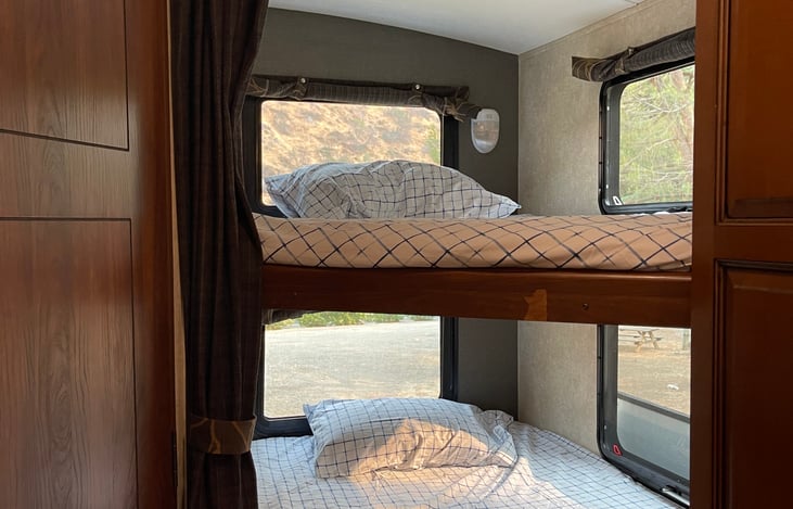 Double bunks - Full size beds
(Rear windows and drivers back side windows)