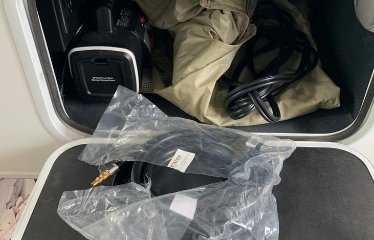 Windshield cover, jumper cable, and air pump.