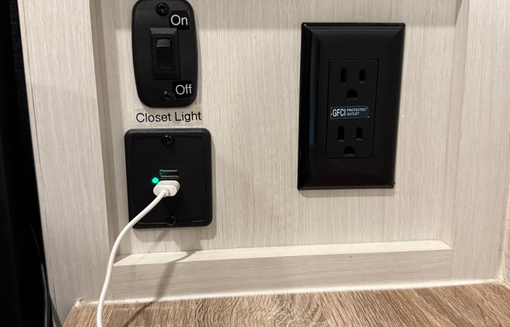 USB and 110V outlet charging stations on both sides of the bed.
