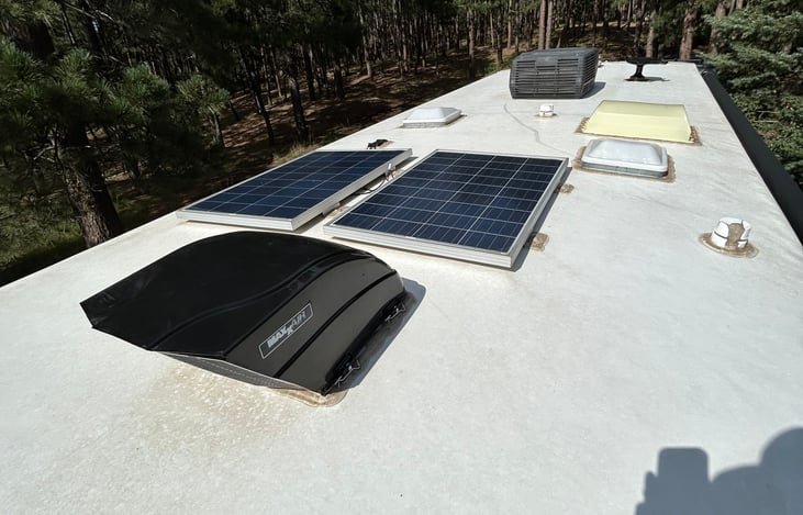 Solar panels charge two 12 Volt batteries located in wheel well.