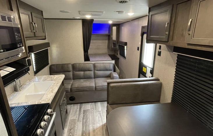 Couch will fold down for additional sleeping. 
Dining table will make into a sleeping area as well.