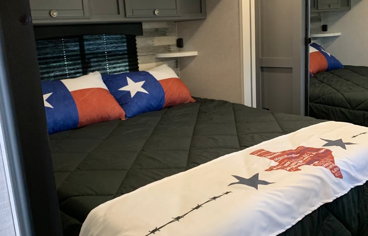 Primary King Bed w/ storage above.  Full length closet w/ mirror sliding doors