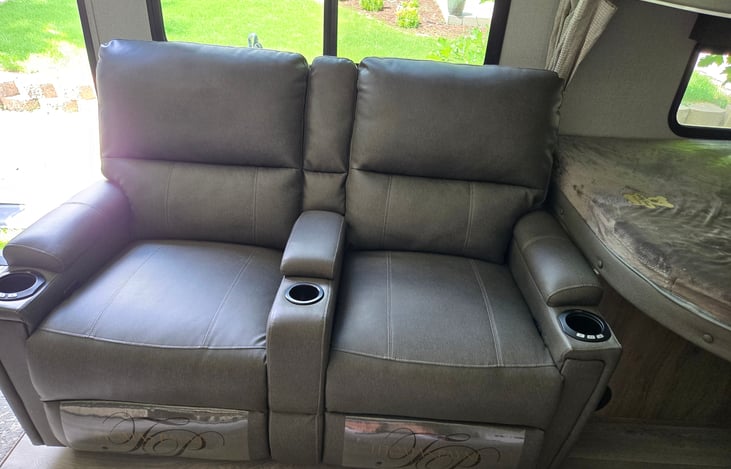 Recliners fold out almost vertical with heating and massage.