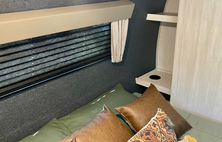 Main bed cubbies include built in shelf with cup holders and are to place personal items.