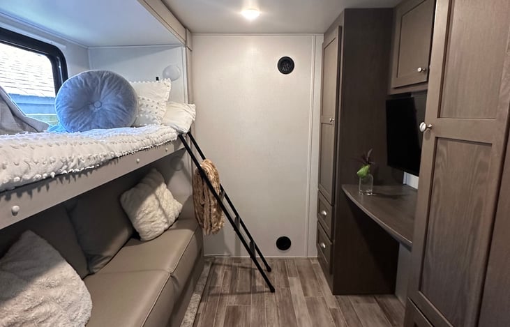 Bunk room with sofa sleeper