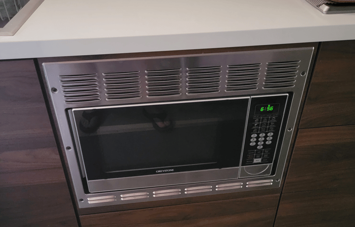 Convection microwave with additional storage below.