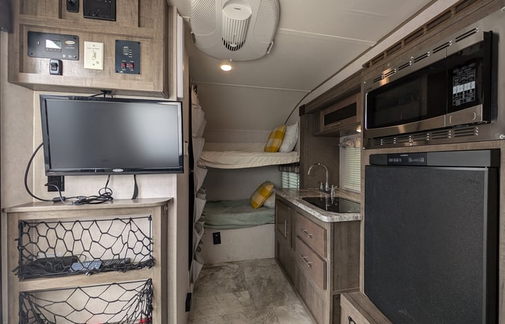 TV with HDMI hookups, radio with great indoor and outdoor speakers, full kitchen, 2 bunk beds