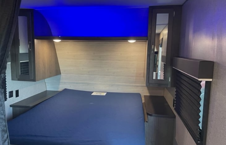 Serene Blue Lighting above Queen Bed