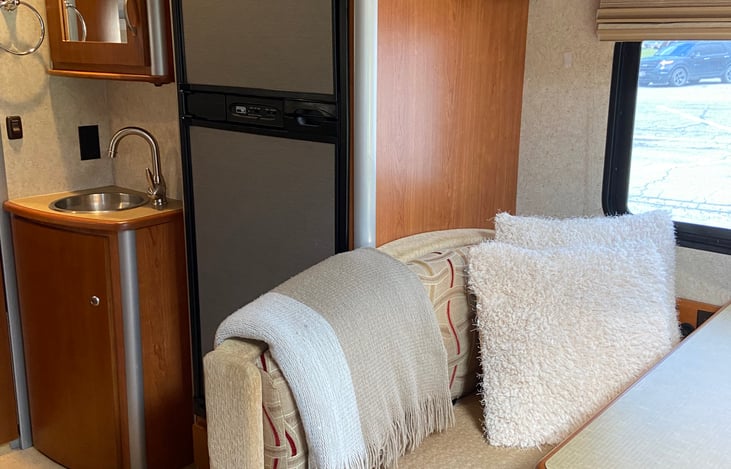 Comfy four person dinette with seatbelts. Converts to single bed.