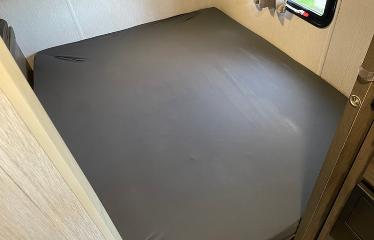 Queen bed in rear bedroom.