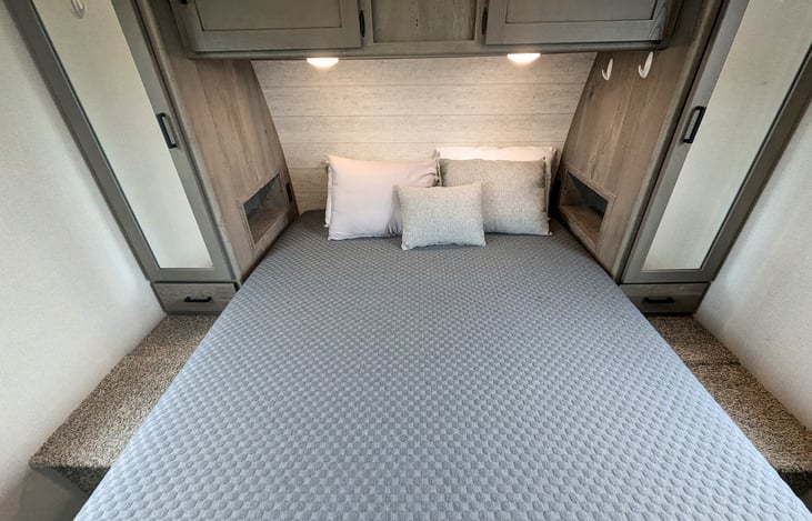 Cozy private bedroom with Queen bed. Ample storage and even a pet kennel is built in.