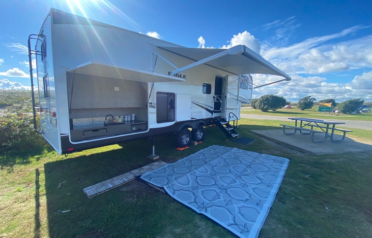 Outdoor Kitchen prep Area with Sink and a Separate Outdoor Refrigerator