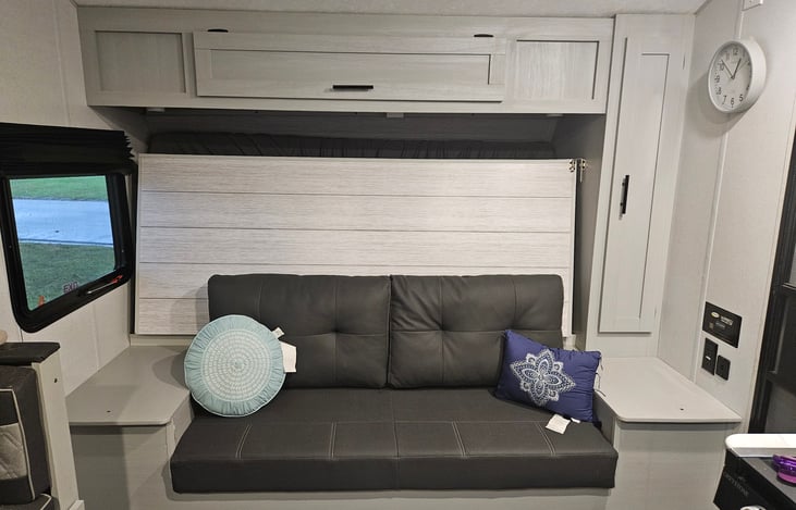 Sofa with the Murphy bed folded up behind