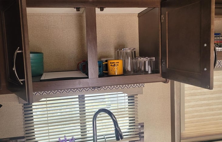 Drinking glasses and coffee mugs provided as well as basic dishes and cooking wear