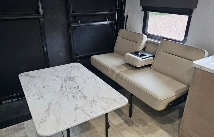 Dining area with table and cupholders