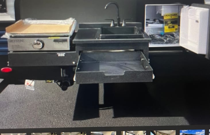 outdoor kitchen, a sink and a mini fridge