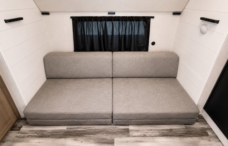 Bunk is above the couch easily pulls down!