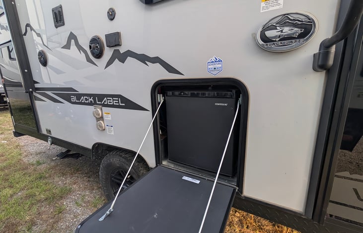 Outdoor mini fridge great for grabbing a cold one while relaxing outside!
