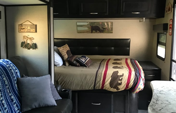 Full Queen bed with memory foam topper and pillows.