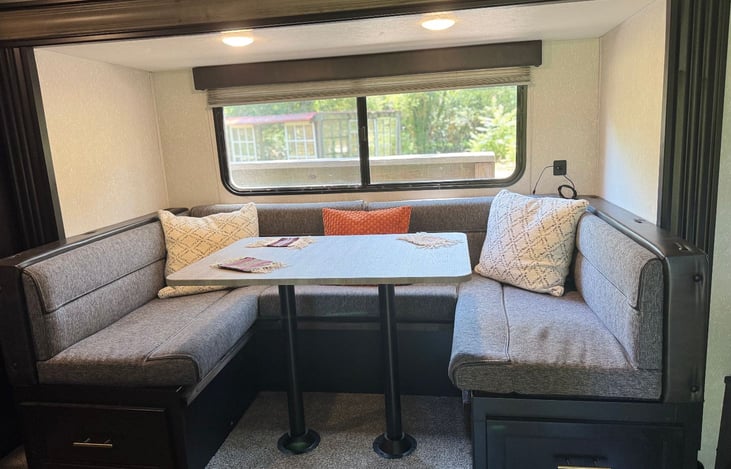 U-shaped dinette is great for card games! Also folds down into a full sized bed for additional sleeping space