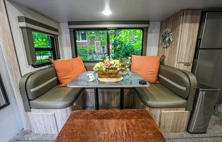 Wrap around dinette, plus ottoman for additional storage, seating and putting your feet up to relax.
